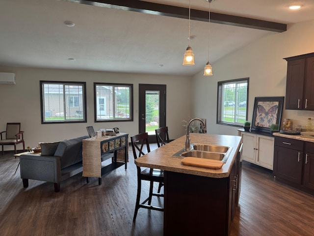 1615 30th St NW Unit 31, Bemidji, MN 56601 - dining space featuring a wall mounted AC, dark wood-style flooring, and bar with sink