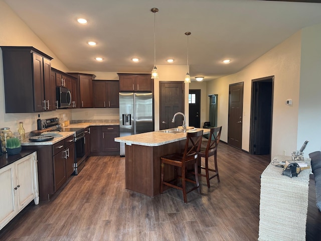 1615 30th St NW Unit 31, Bemidji, MN 56601 - kitchen with stainless steel appliances, a sink, light countertops, dark wood-type flooring, and dark brown cabinets