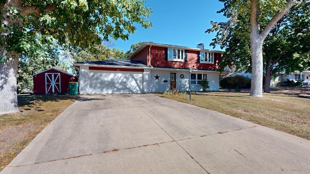 view of front facade with a garage and a front yard