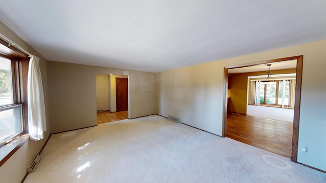 empty room with light hardwood / wood-style floors