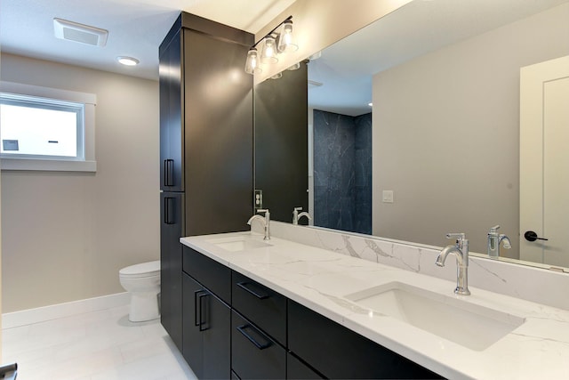 bathroom with vanity and toilet