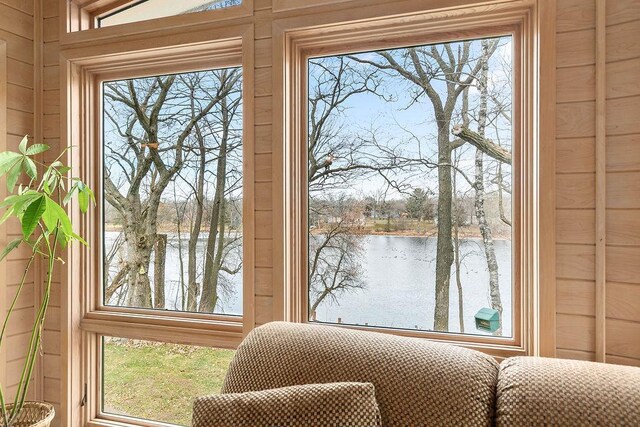 interior space featuring a water view and plenty of natural light