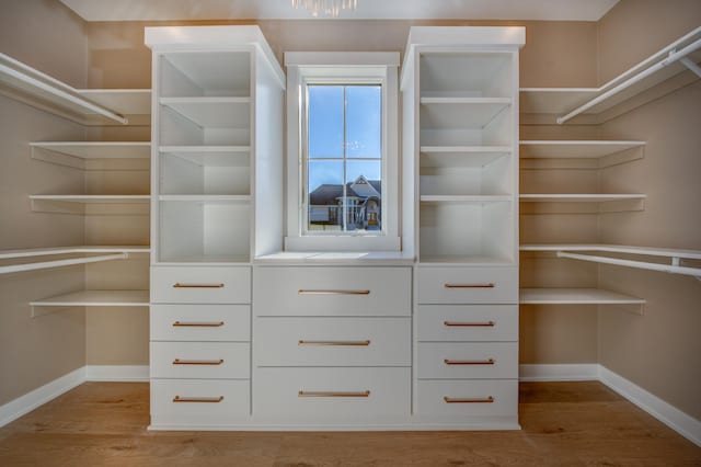 walk in closet featuring light hardwood / wood-style floors