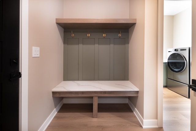 mudroom featuring washer / dryer and light hardwood / wood-style flooring