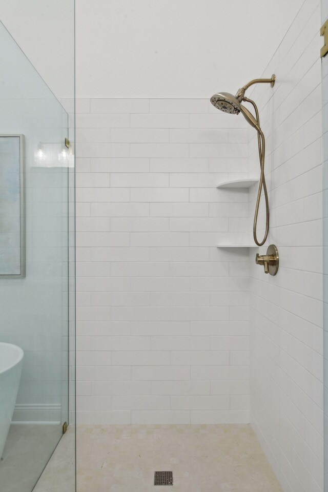 bathroom featuring independent shower and bath