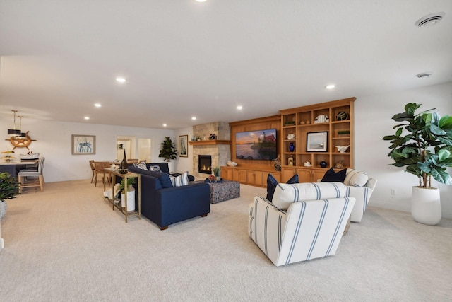 living room with light carpet and a fireplace