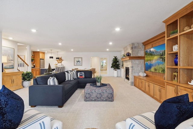 carpeted living room featuring a fireplace