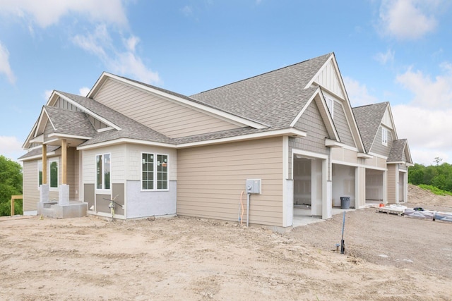 view of side of property featuring a garage