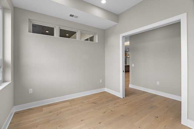 spare room with light hardwood / wood-style flooring