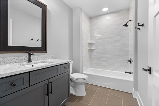 full bathroom with tile patterned floors, vanity, toilet, and tiled shower / bath combo