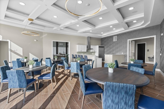 dining area with coffered ceiling