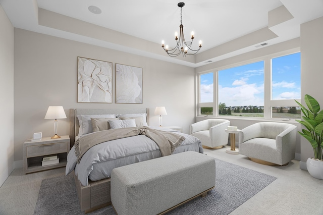 1 Hill Farm Rd Unit 205, North Oaks, MN 55127 - bedroom with a chandelier, a raised ceiling, and carpet