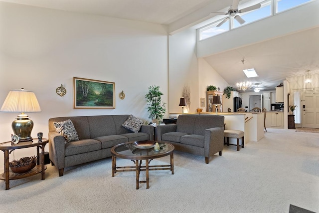 living room featuring light carpet, beamed ceiling, ceiling fan with notable chandelier, and high vaulted ceiling