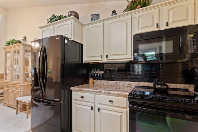 kitchen featuring backsplash and black appliances