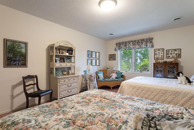 bedroom featuring a textured ceiling