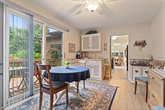 dining room featuring ceiling fan and light wood-type flooring