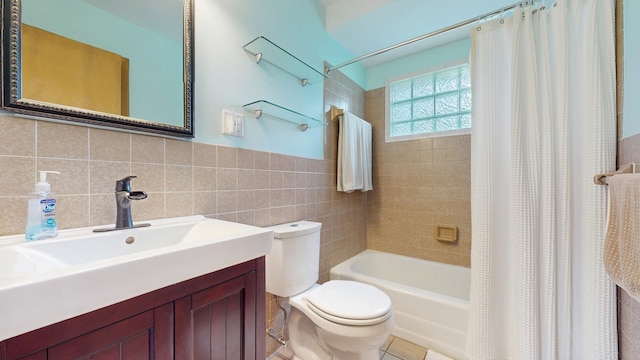4200 Overlook Dr, Bloomington, MN 55437 - bathroom with shower / tub combo, tile walls, vanity, and tile patterned flooring