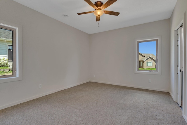 interior space featuring carpet floors and ceiling fan