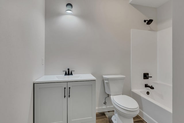 full bathroom with vanity, shower / washtub combination, wood-type flooring, and toilet