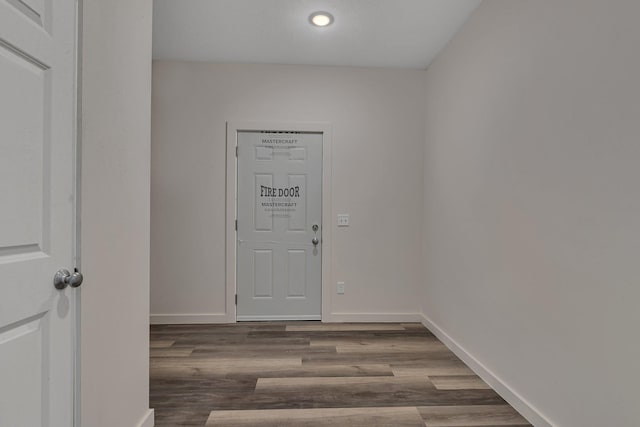 unfurnished room featuring dark hardwood / wood-style flooring