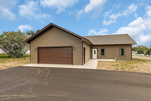 ranch-style house featuring a garage