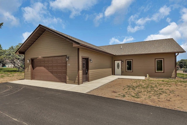 ranch-style home with a garage