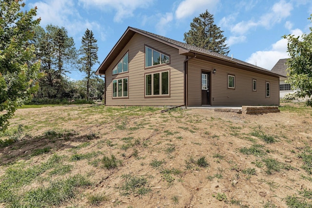 rear view of property with a patio area