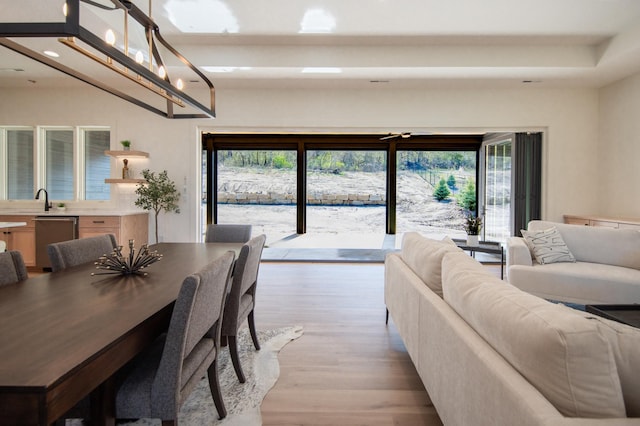 dining room featuring light wood-type flooring and recessed lighting