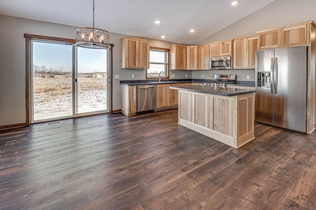 kitchen featuring sink, a center island, hanging light fixtures, dark hardwood / wood-style flooring, and stainless steel appliances