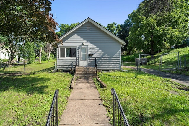 bungalow-style home featuring a front yard