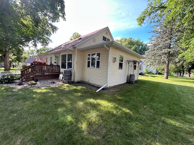 625 10th St, Montevideo, MN 56265 - view of side of home featuring central AC unit, a yard, and a deck