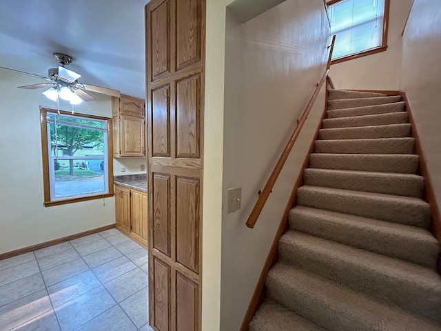 625 10th St, Montevideo, MN 56265 - stairs featuring tile patterned floors, baseboards, and ceiling fan