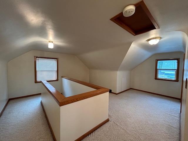 625 10th St, Montevideo, MN 56265 - bonus room featuring light colored carpet, vaulted ceiling, and baseboards