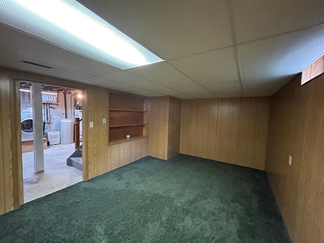 625 10th St, Montevideo, MN 56265 - finished basement with gas water heater, visible vents, wooden walls, and carpet