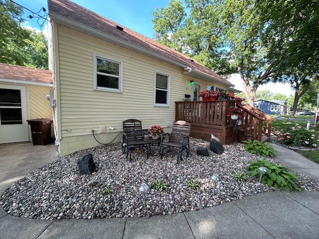 625 10th St, Montevideo, MN 56265 - back of house with a wooden deck and a shingled roof