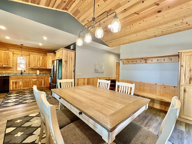 dining space with sink, dark hardwood / wood-style floors, lofted ceiling, and wood ceiling