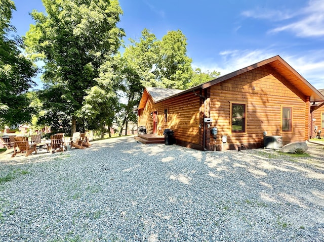 view of property exterior with a patio area