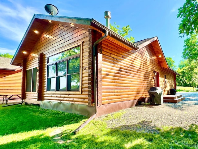 view of home's exterior with a yard