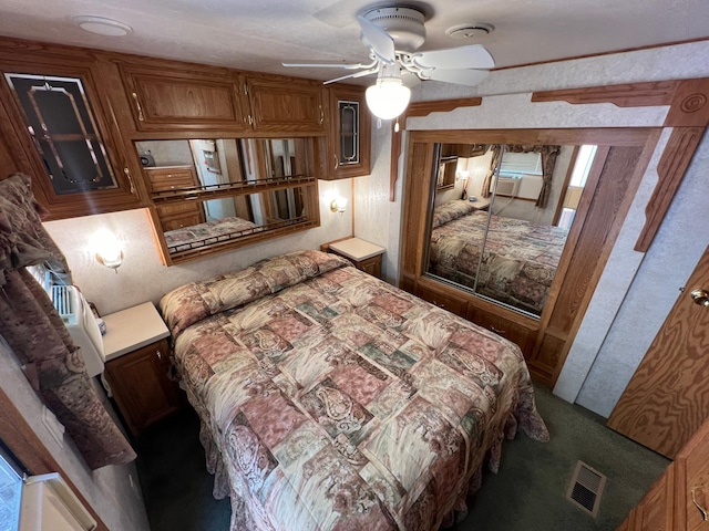 bedroom featuring cooling unit and ceiling fan