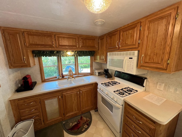 kitchen with light tile patterned floors and white appliances