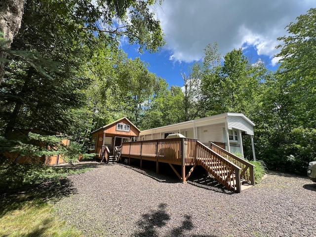 back of property with a wooden deck