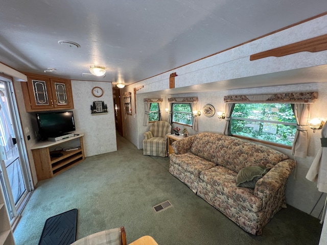 living area featuring light colored carpet and visible vents