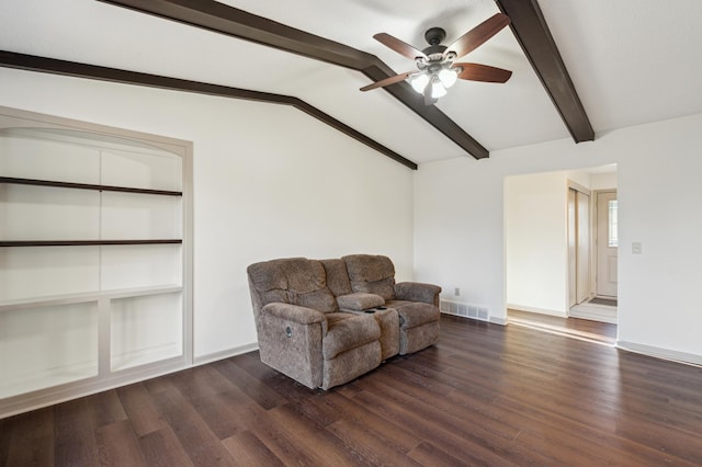 living area featuring vaulted ceiling with beams, built in features, ceiling fan, and dark wood-type flooring