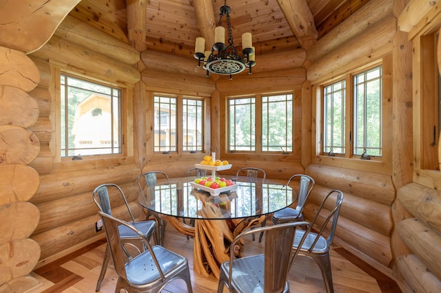 dining space with rustic walls and light hardwood / wood-style flooring