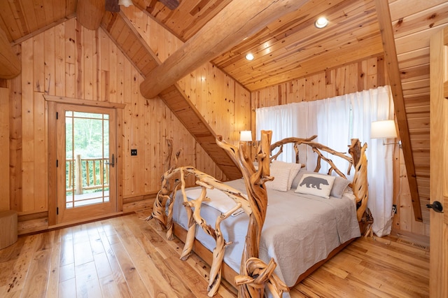 bedroom featuring light hardwood / wood-style flooring, wooden walls, wooden ceiling, access to exterior, and beamed ceiling