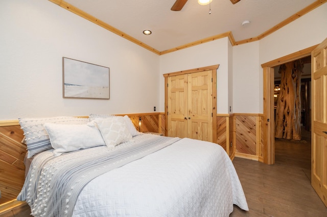 bedroom featuring ceiling fan, crown molding, and dark hardwood / wood-style floors