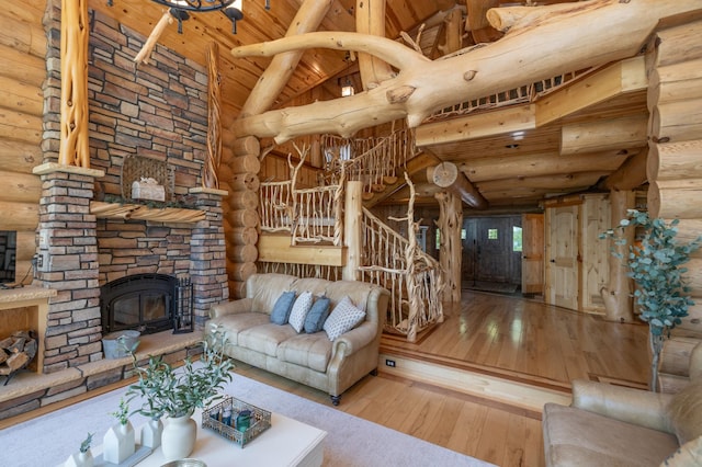 living room featuring rustic walls, hardwood / wood-style floors, wood ceiling, and beam ceiling