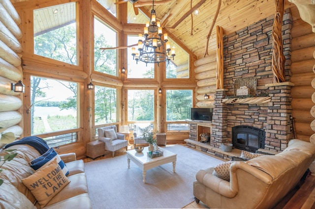 living room with rustic walls, high vaulted ceiling, and a chandelier