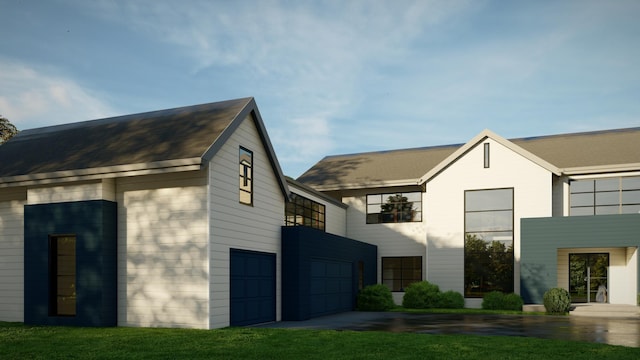 view of front facade with a garage and a front yard