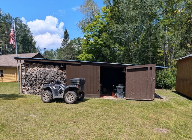 view of outbuilding with a yard